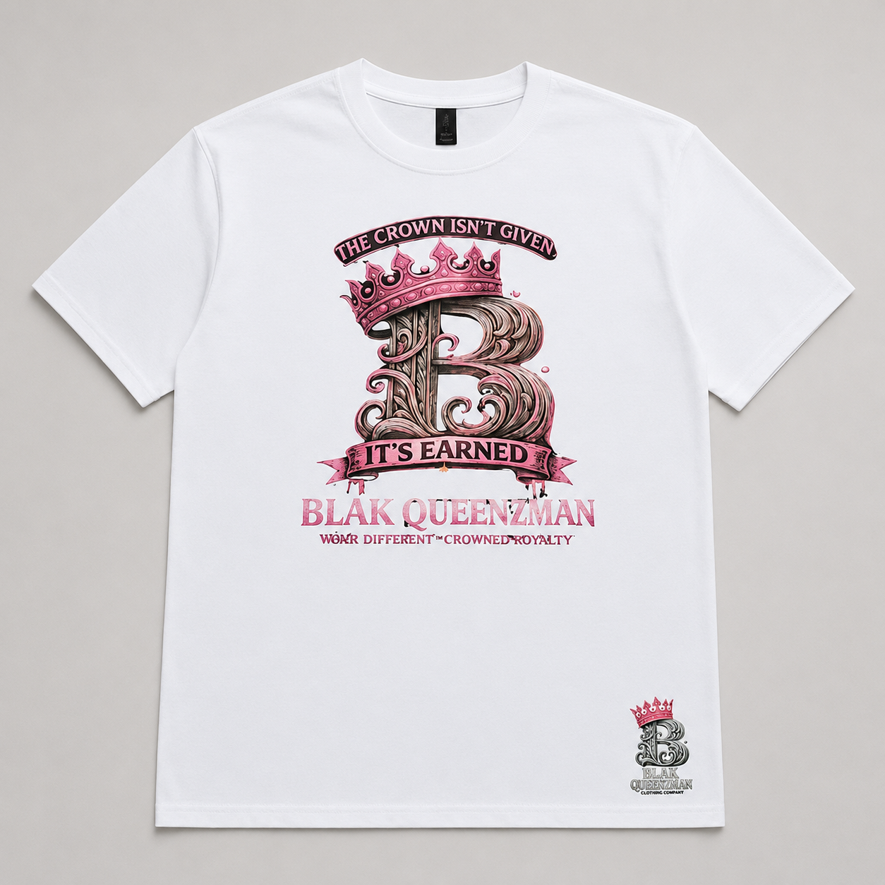 BLAK QUEENZMAN The Crown Isn't Given White Tee — pink crowned B monogram with The Crown Isn't Given It's Earned on white tee