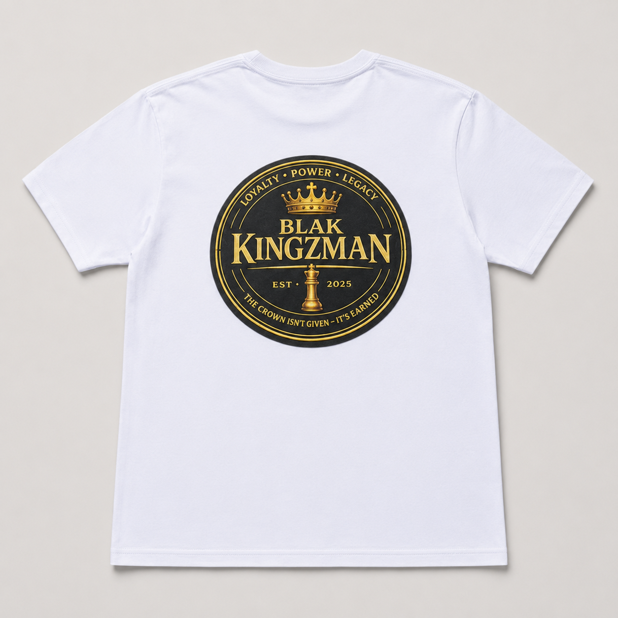 BLAK KINGZMAN Loyalty Power Legacy White Tee — back graphic: gold coin crest with Loyalty Power Legacy and BLAK KINGZMAN Est. 2025