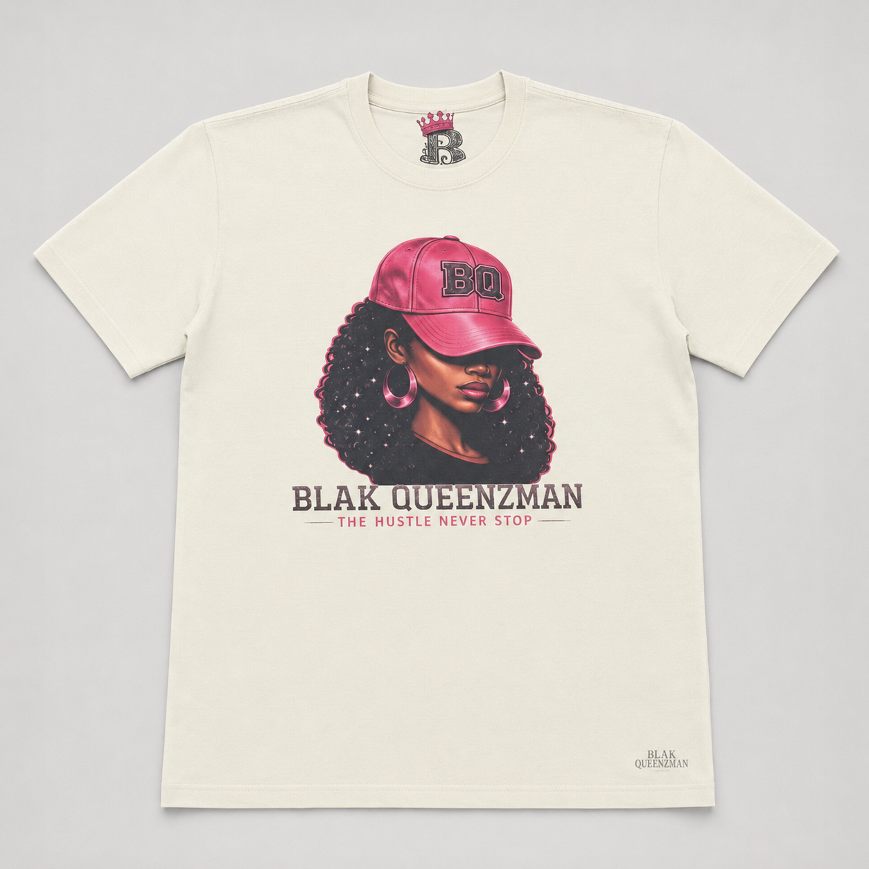BLAK QUEENZMAN Hustle Tee — illustrated woman in pink BQ cap, The Hustle Never Stop, cream tee