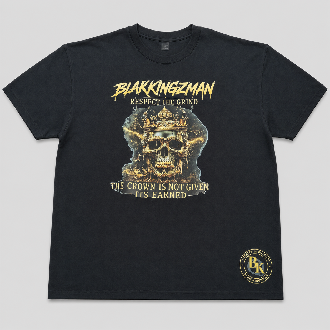 BLAK KINGZMAN Respect the Grind Gold Skull Black Tee — gold crowned skull with BLAKKINGZMAN and Respect the Grind on black unisex tee