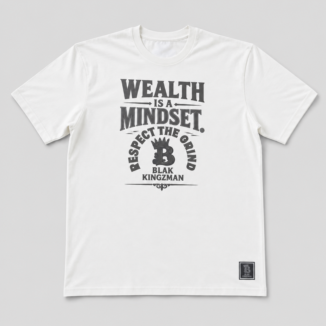 BLAK KINGZMAN Wealth Is a Mindset White Tee — bold statement print with Respect the Grind arc and crowned B